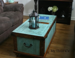 ***SOLD***Turquoise and Dark Stain Distressed Chest. Rich color and beautiful carved detail. Original hardware with soft close hinges.